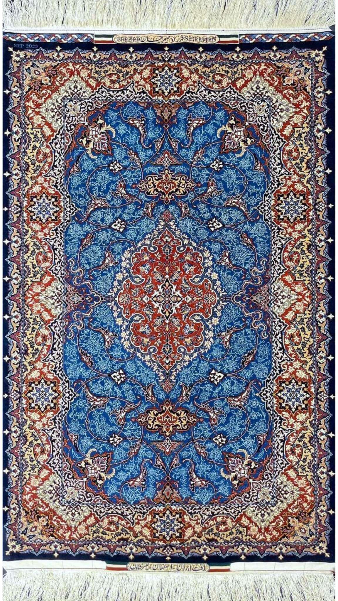 Hand-knotted Persian rug by Farzad Seirafian featuring a royal blue field and red medallions.
